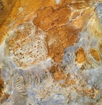 Abstract mining background, orange and grey colors of copper mine tailings Stock Photos
