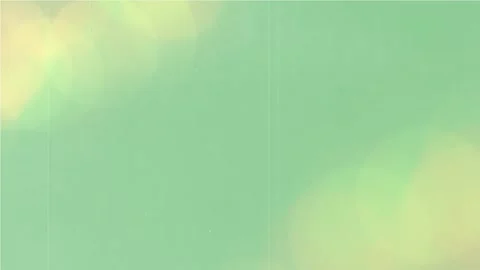Abstract mint green background featuring soft glowing golden bokeh circles with Video stock 345216699