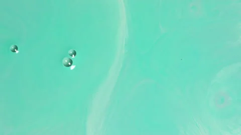 Abstract mint green fluid motion with soft liquid swirls and bubbles Stock-Footage 331688638