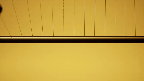 Abstract modern loop animation of metal balls seeded on twine and spinning a Stock Footage 246676865