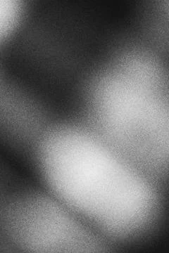 Abstract monochrome blurred background with soft light and grain texture Stock Photos
