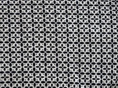 Abstract monochrome dot pattern on textile fabric surface Stock Photos