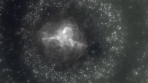 Abstract monochrome energy sphere surrounded by glowing particles and smoky.. Stock Footage 345511854