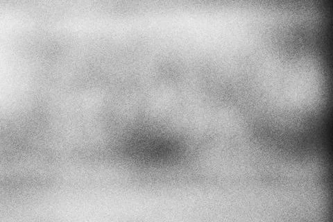 Abstract monochrome grainy texture background with soft light gradients Stock Photos