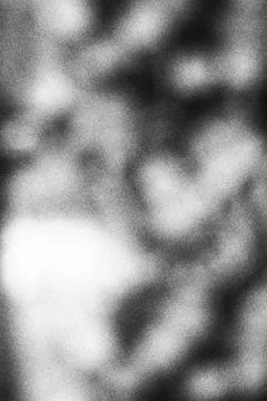 Abstract monochrome light bokeh background with soft grain texture Stock Photos