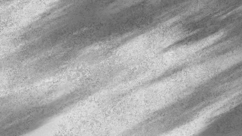 Abstract monochrome light reflection shimmers along textured gray concrete wall Stock Footage 339888819