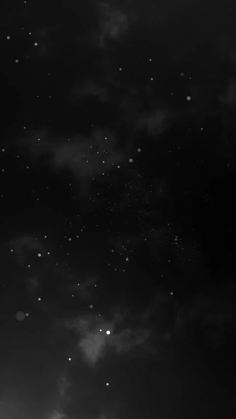 Abstract monochrome particles falling against a dark cloudy sky background Stock Footage 339770356