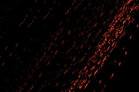 Abstract motion blur light background of particles. Red sparks. Stock Photos
