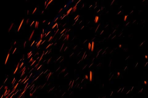 Abstract motion blur light background of particles. Red sparks. Stock Photos