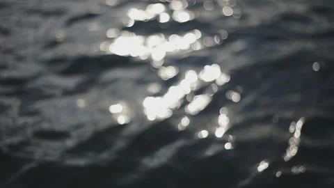 Abstract motion of the sunset sea, shimmering water defocused background, bokeh 库存影片 230961914
