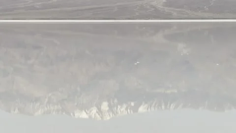 Abstract Mountain Ghosts Shimmer in Flooded Basin Waters Stock Footage 331275267