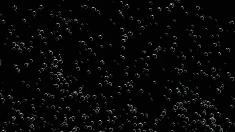 Abstract movement of white air bubbles on a dark background. 스톡 동영상 125999543