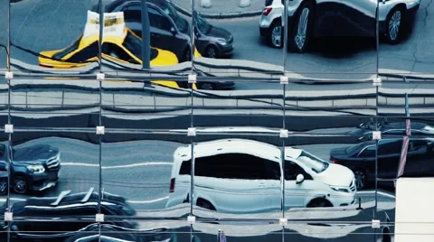 Abstract moving city traffic reflections in building mirror windows. Slow motion Stock Footage