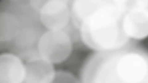 Abstract moving silver and white bokeh lights animation background, 4k loop Stock Footage 212434555
