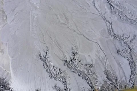 Abstract mud cracks and patterns aerial view Stock Photos