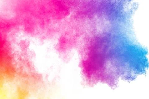 Abstract multi color powder explosion on white background.Freeze motion of .. Illustrazione stock