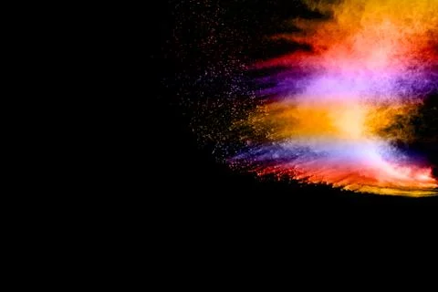 Abstract multi color powder explosion on black background. Stock Photos