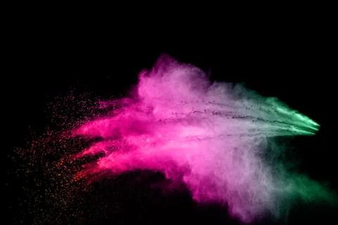 Abstract multi color powder explosion on black background. Stock Photos