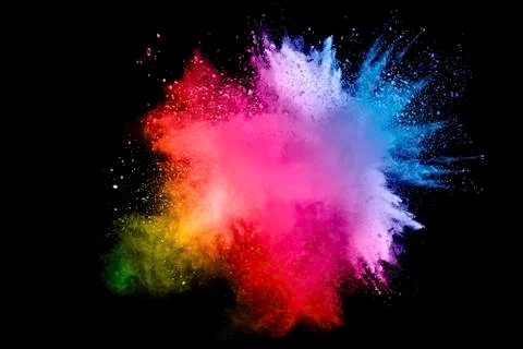 Abstract multi color powder explosion on black background. Stock Photos