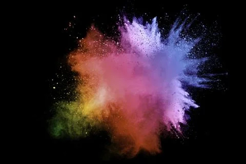 Abstract multi color powder explosion on black background. Freeze motion of.. Stock Photos