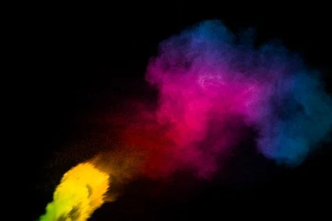 Abstract multi color powder explosion on black background. Freeze motion of.. Stock Photos