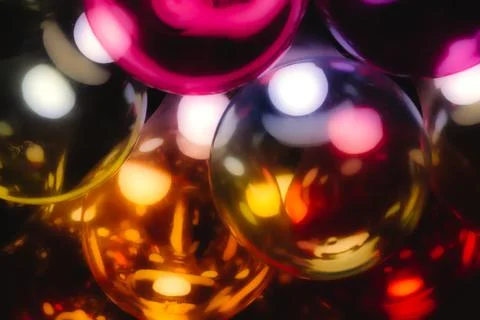 Abstract multi-colored glass light bulbs with a warm glow Stock Photos