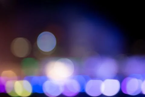 Abstract multicolor bokeh light texture on black background. Stock Photos