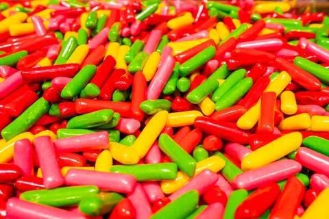 Abstract multicolored background made of many colorful sweet sticks of chewing Stock Photos