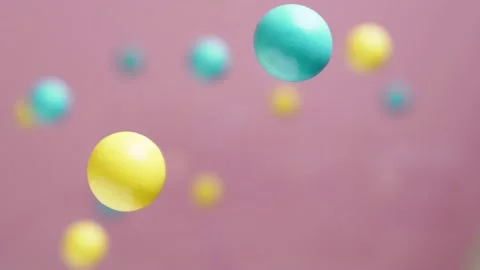 Abstract multicolored balls are moving on pink background, 3D effect. Stock Footage 159767611