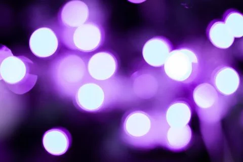 Abstract multicolored bokeh on a dark background Stock Photos