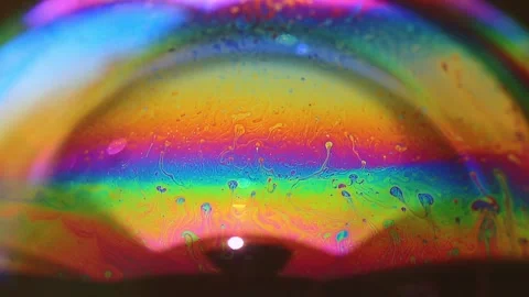 Abstract multicolored chaotic swirl texture inside of the soap bubble, closeup Video stock 245385834