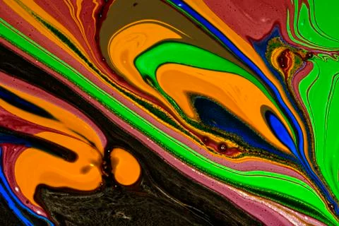 Abstract multicolored liquid solution surface macro close up from above Stock Photos