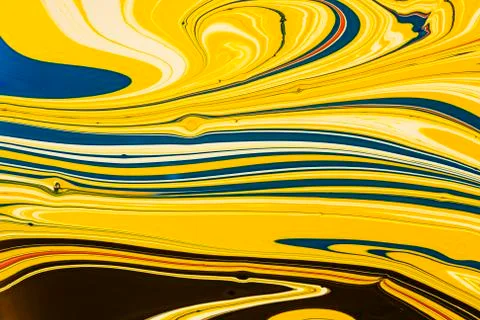 Abstract multicolored liquid solution surface macro close up from above Stock Photos