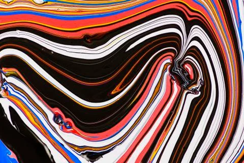 Abstract multicolored liquid solution surface macro close up from above Stock Photos
