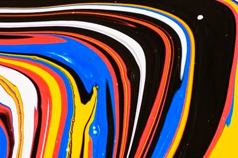 Abstract multicolored liquid solution surface macro close up from above Stock Photos