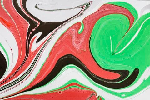 Abstract multicolored liquid solution surface macro close up from above Stock Photos