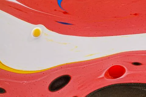 Abstract multicolored liquid solution surface macro close up from above Stock Photos