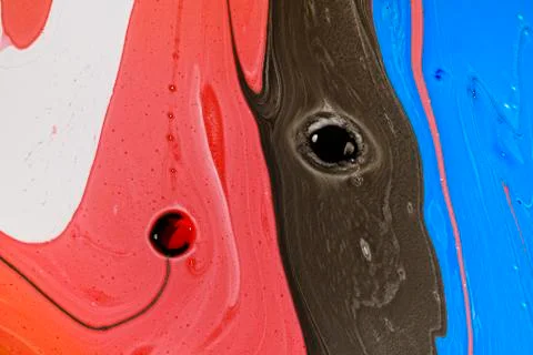 Abstract multicolored liquid solution surface macro close up from above Stock Photos