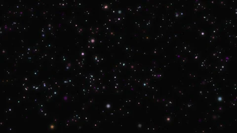 Abstract multicolored particles and glitter floating on a dark blurred 库存影片 339047807