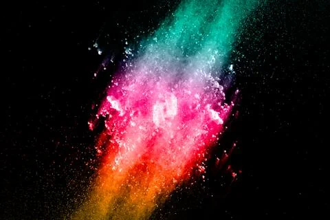 Abstract multicolored powder splatted on black background Stock Photos