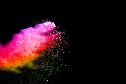 Abstract  multicolored powder splatted on black background. Stock Photos