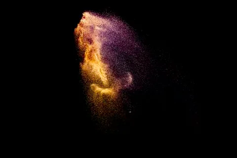Abstract multicolored sand explosion isolated on black background. Foto stock