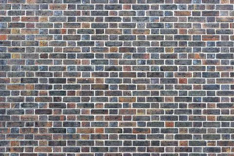 Abstract of a multicoloured brick wall background texture Stock Photos