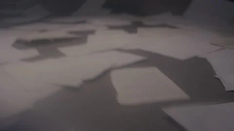 Abstract Mysterious Blurred Documents Fall and Cover the Floor Under Light Stock Footage 210220786