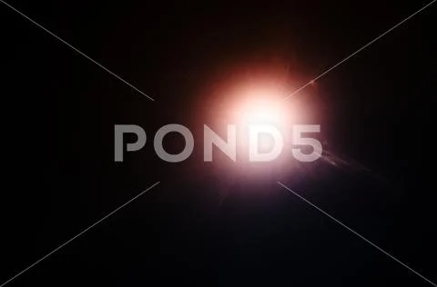 Abstract Natural Sun flare or Far star on the black background Stock Photos