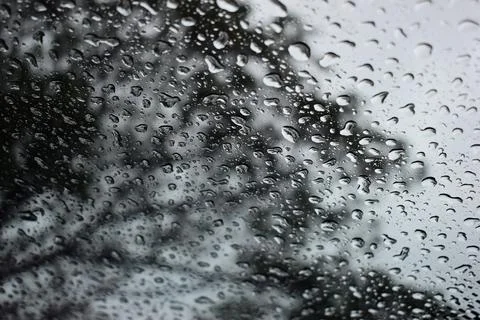 Abstract natural texture of raindrop moisture beads on transparent glass wind Stock Photos