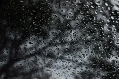 Abstract natural texture of raindrop moisture beads on transparent glass wind Stock Photos