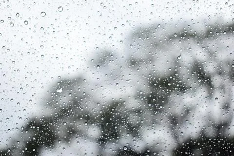 Abstract natural texture of raindrop moisture beads on transparent glass wind Stock Photos