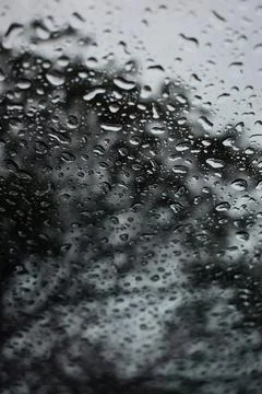 Abstract natural texture of raindrop moisture beads on transparent glass wind Stock Photos