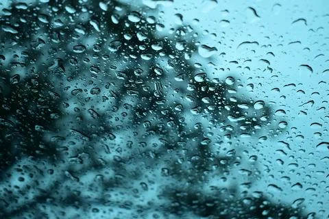 Abstract natural texture of raindrop moisture beads on transparent glass wind Stock Photos